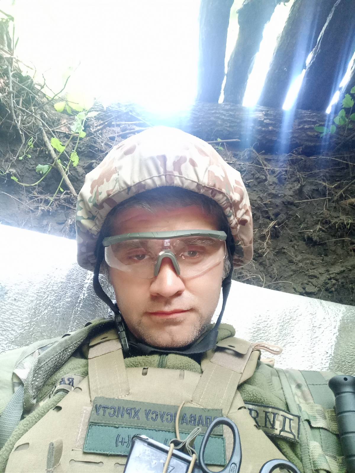 Chaplain Viacheslav in a dugout position